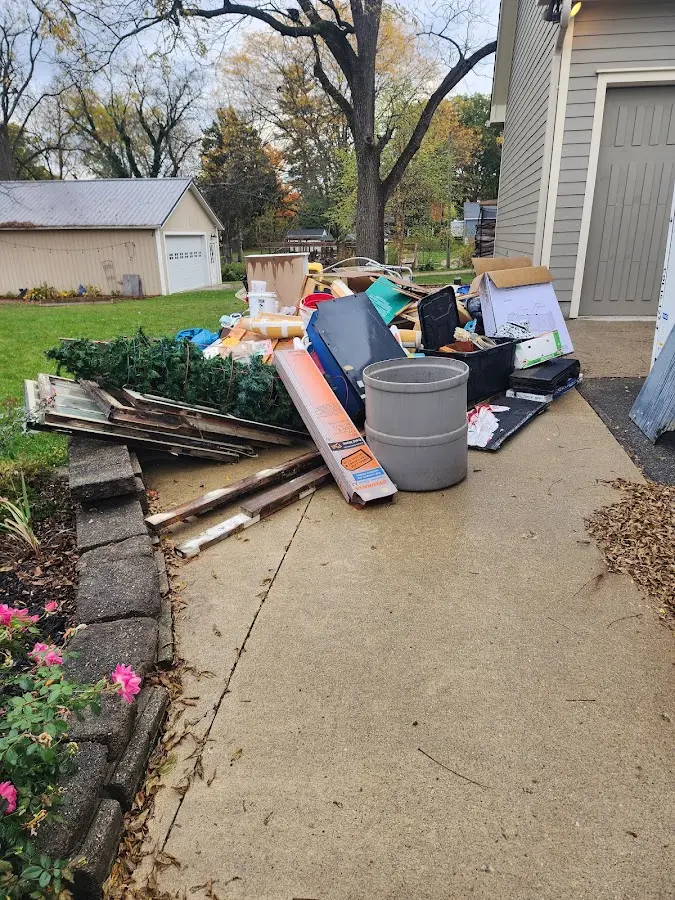 Dumpster being loaded with debris for Roofing Dumpster Rental in Linganore